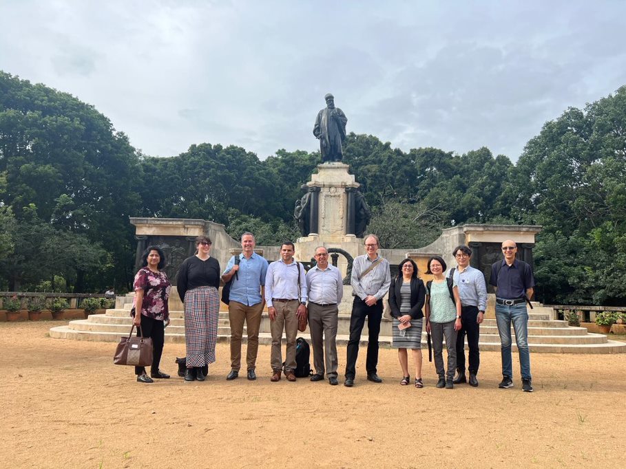 Delegates in front of a monument