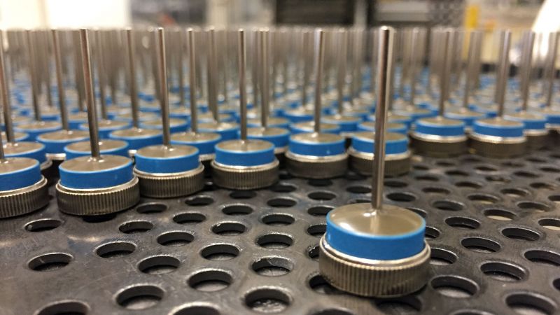 Rows of blue and silver diodes on a metal platform