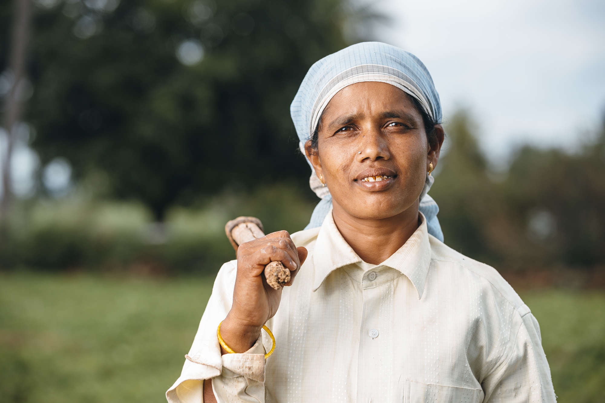 Indian farmer woman in farm field