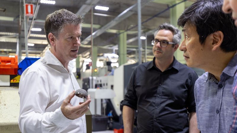 Peter Lee and researchers tour Signature Orthopaedics manufacturing facilities