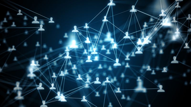 Human-shaped icons float in a digital-looking space, connected in clustered networks