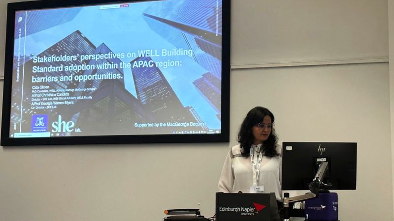 Cida Ghosn wears a neat white shirt while presenting on the Stakeholders' perspectives on WELL Building Standard adoption within the APAC region and its barriers and opportunities