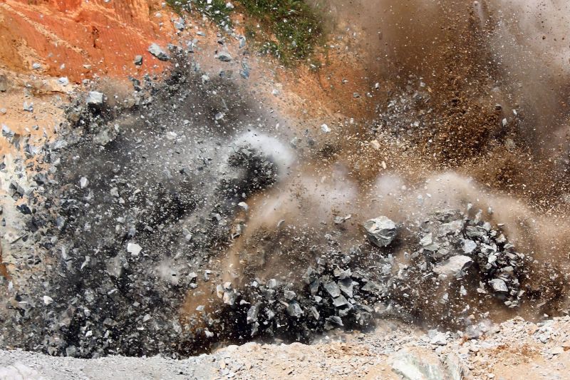 An explosion of rock by a mining company